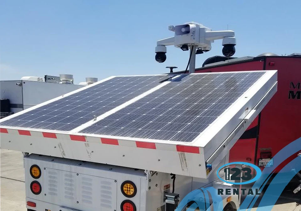 Security camera trailer with solar panels and mounted cameras