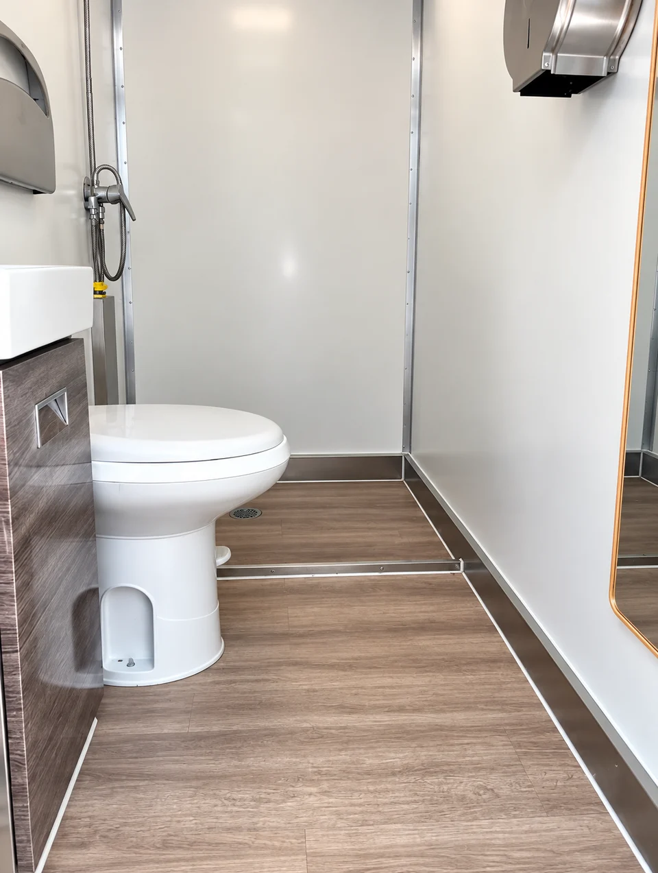 Toilet interior in a shower and restroom combination trailer; restroom-only unit not pictured